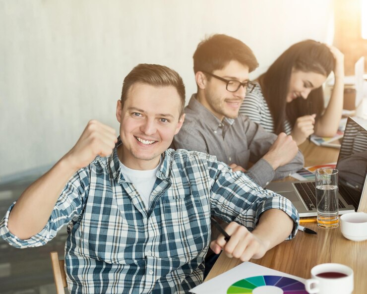 happy-top-manager-young-business-team-celebrating-successful-project-loft-office-copy-space_116547-9615