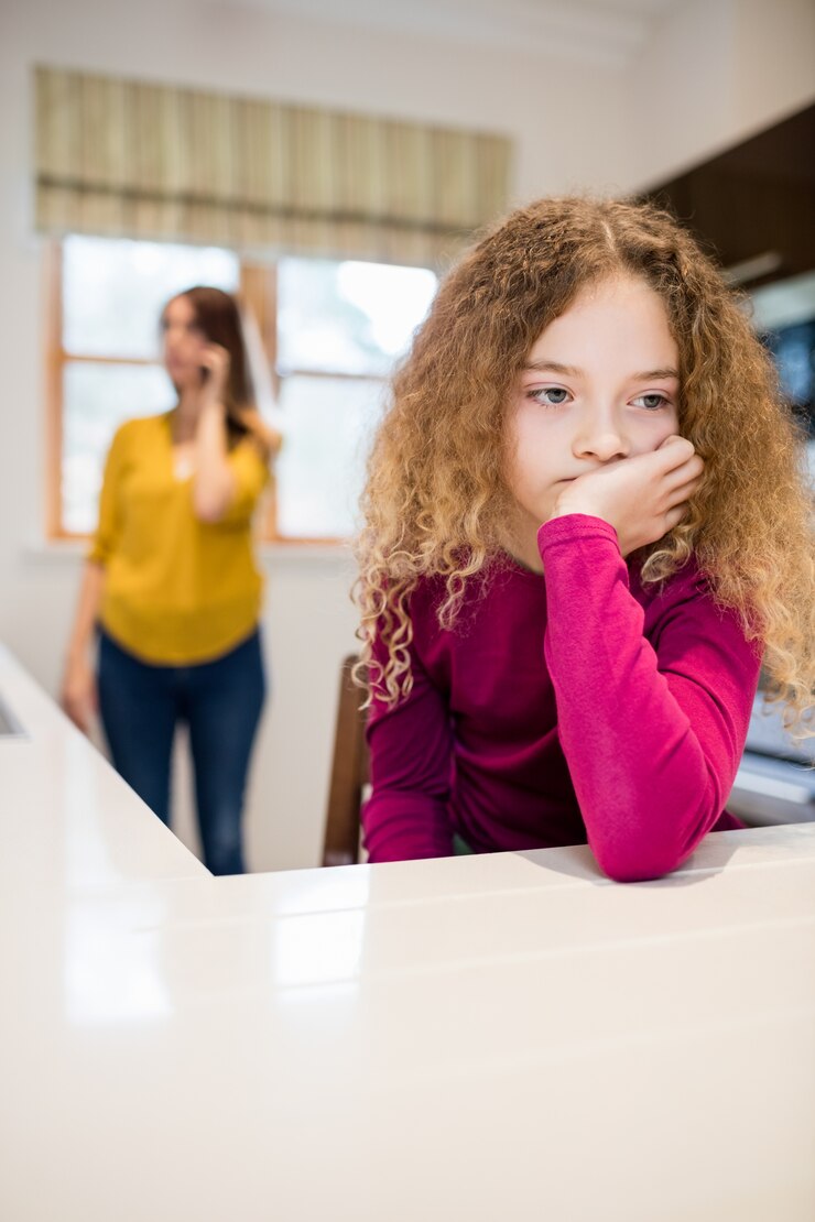 sad-girl-sitting-kitchen_1170-2632