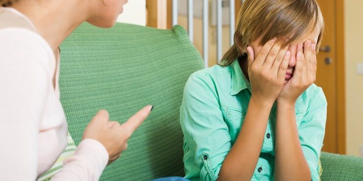 mother-scolding-teenage-son_1398-4906