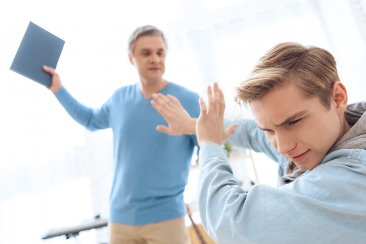 troubled-teenager-covers-himself-with-hands_99043-3534