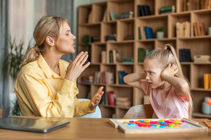 unruly-little-girl-closing-ears-with-hands-expressing-negative-emotions-looking-teacher-having-private-lesson_116547-33423
