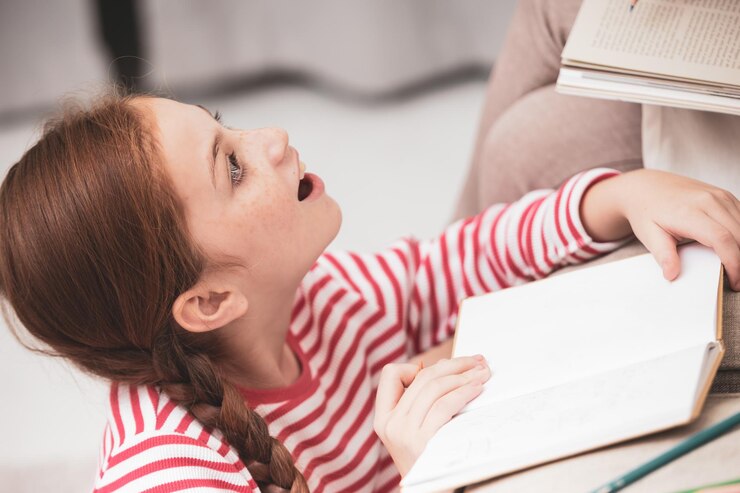 high-angle-view-girl-studying-table_1048944-16812293