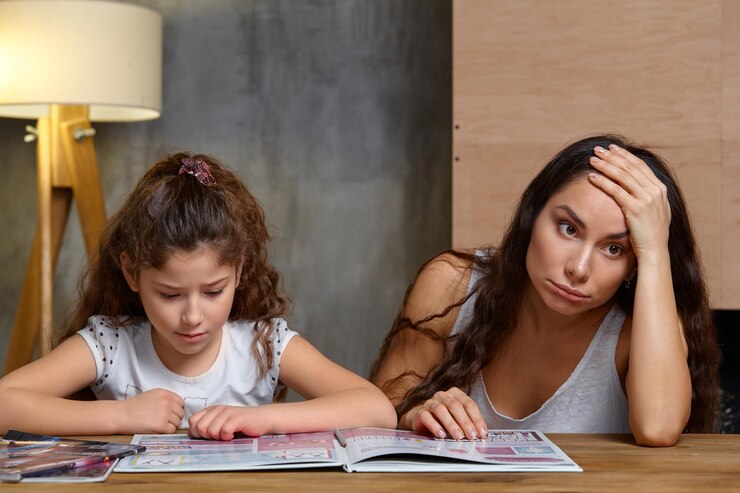 portrait-mother-helping-her-small-sweet-cute-daughter-make-her-homework-indoors-happy-fa_157927-17059